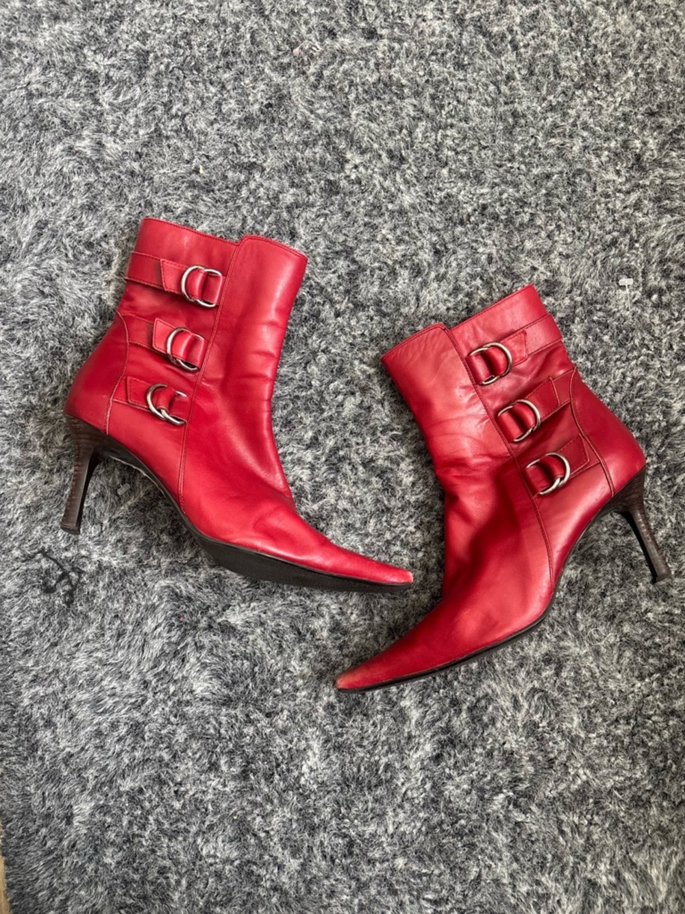 Valerie Steven’s Red Leather Ankle Boots with Buckle details